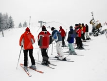 line of people undergoing ski instruction