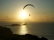 paragliding into the sunset