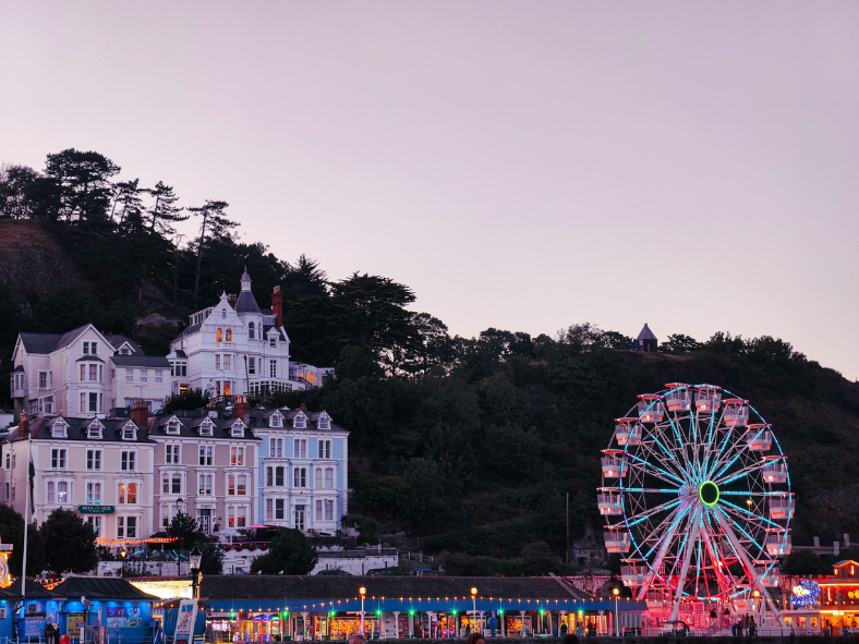 A seaside town at Christmas has a quiet kind of magic. The summer crowds have gone, the promenade lights glow against a dark winter sea